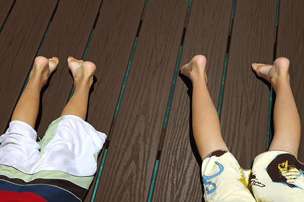 Endeck Forest series, images shows boys laying on deck boards