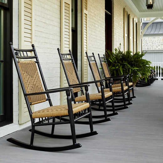 Rocking chairs on a TimberTech porch made from Coastline boards