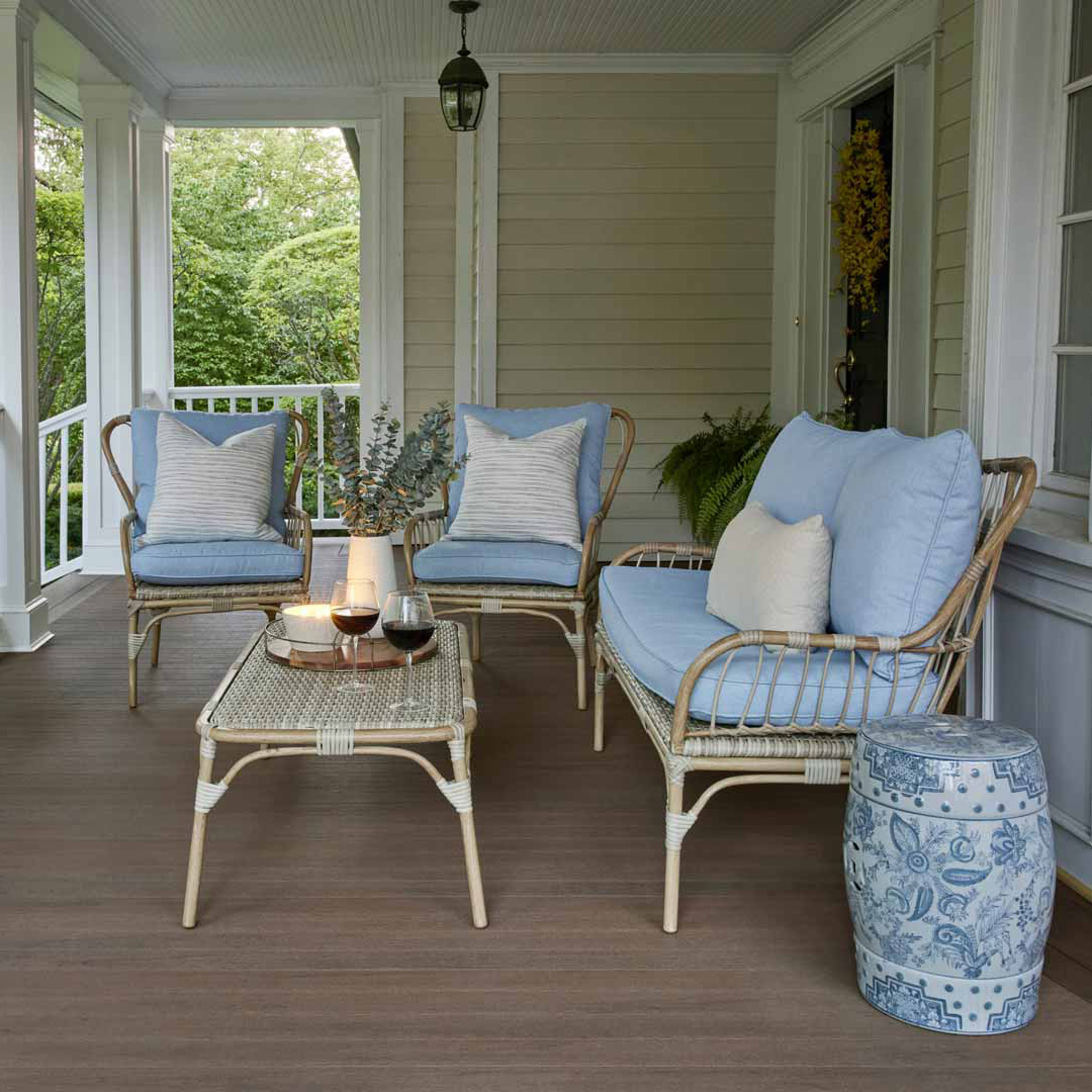sitting area under a coverd porch. TimberTech porch made from Mahogany boards