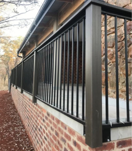 Detail of corner railing showing baluster infill and top rail