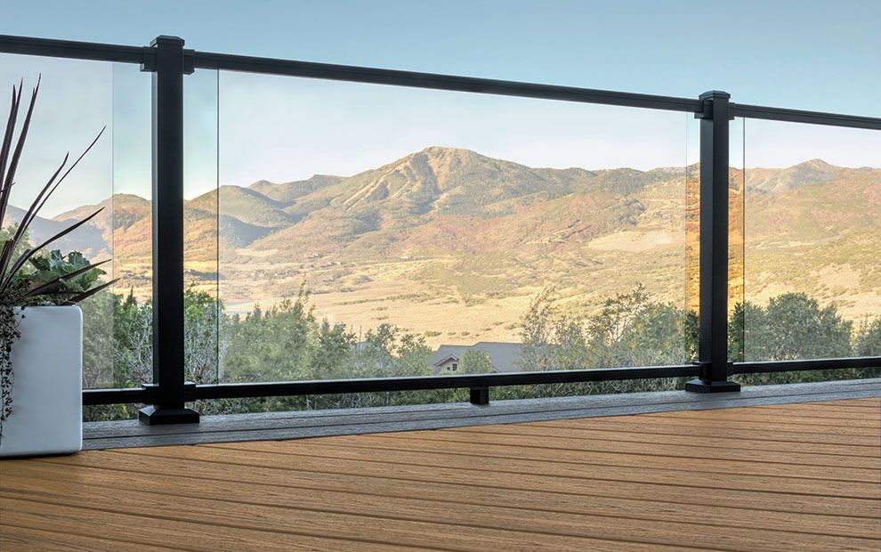 trex decking havana gold with Trex signature railing, glass insert, charcoal-black rail