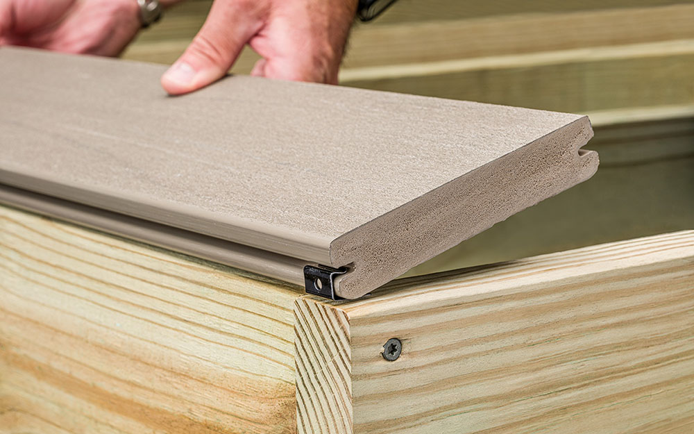 slipping deck board into starter clisps